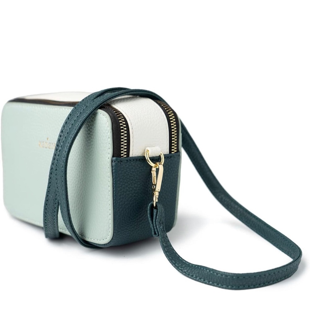 Kedzie leather crossbody compact purse with adjustable strap.